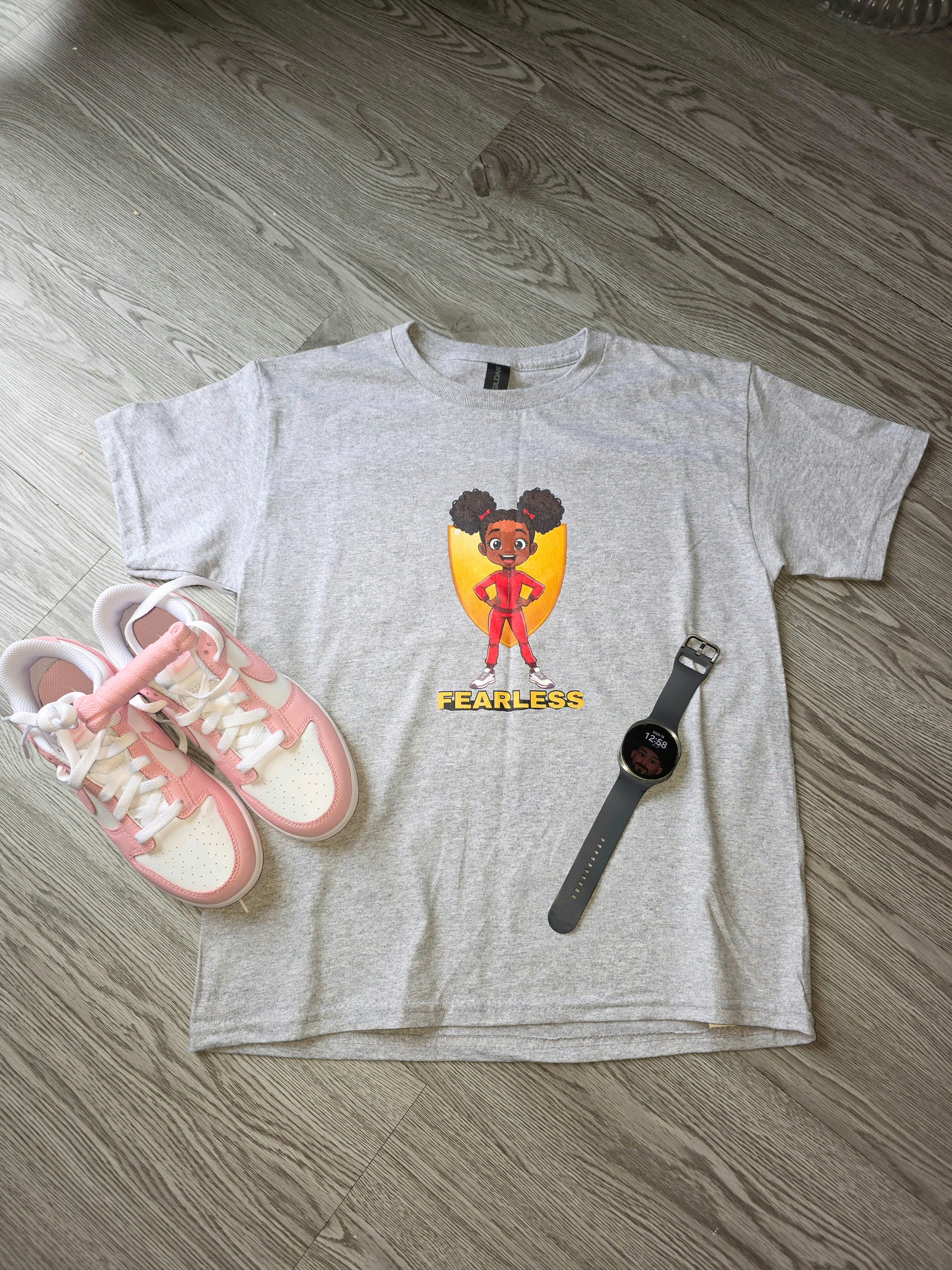 Grey organic cotton kids streetwear t-shirt featuring empowering fearless girl graphic. Global Family Threads UK.
